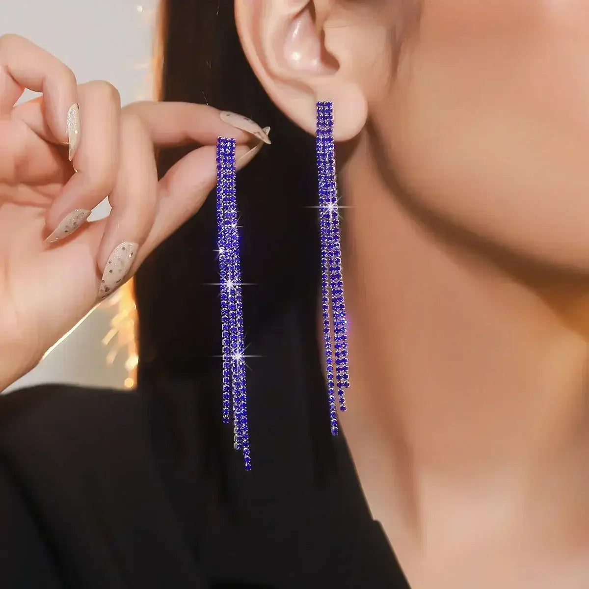 TREAZY earrings featuring long purple rhinestone crystal tassel drop design with sparkling multi-strand strands