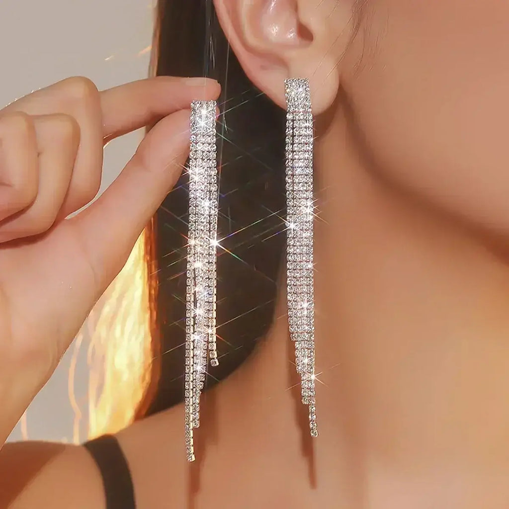 TREAZY earrings sparkling silver rhinestone crystal tassel long drop earrings worn on ear and held by hand