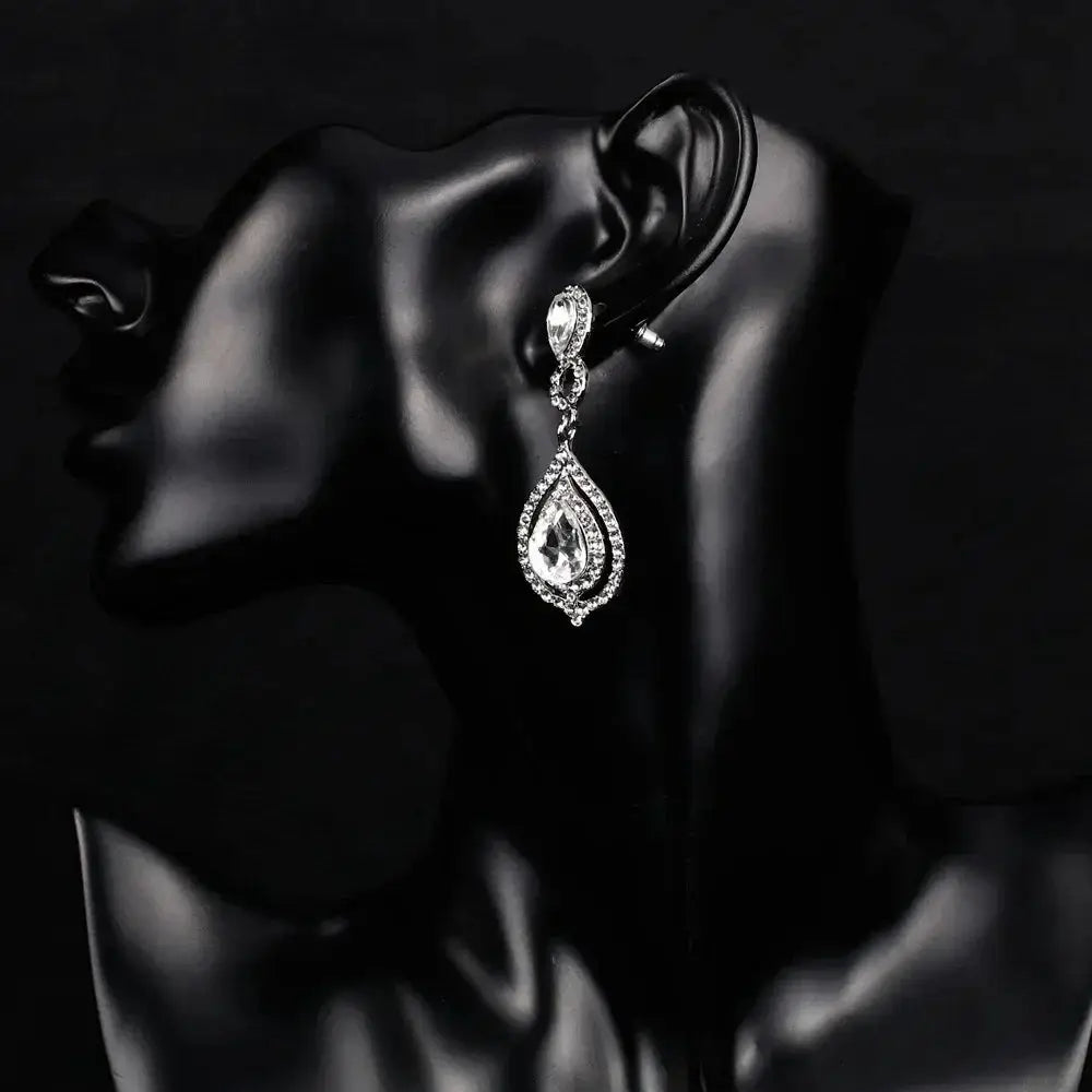 TREAZY Fashion Crystal Earrings silver color zinc alloy drop earrings with clear crystal teardrop design on black mannequin