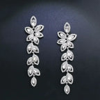 TREAZY Fashion Crystal Earrings silver color bridal drop earrings with leaf-shaped crystal design on black background