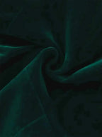 Velvet Double-Breasted Blazer fabric in deep emerald green with a soft, smooth texture and subtle stretch.
