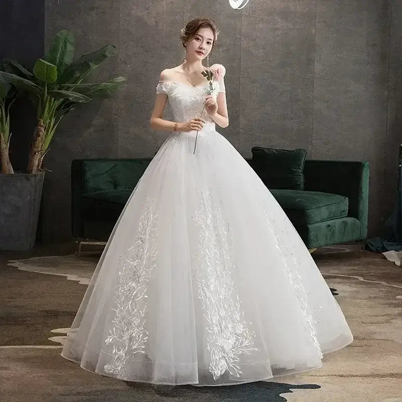 Wedding Dress 2024 off shoulder white ball gown with V-neck, lace appliques, embroidery, and floor-length tulle skirt
