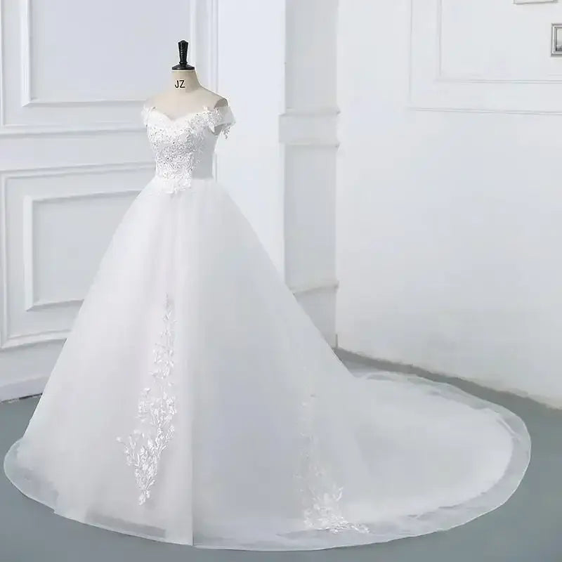 Wedding Dress 2024 white ball gown with off the shoulder short sleeves, V-neckline, lace appliques, and a long train