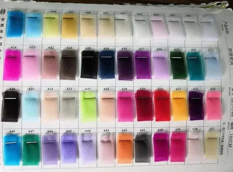 Wedding Dresses fabric swatches in various colors including blue, pink, black, purple, red, orange, and green arranged in rows on a display card
