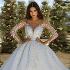 Wedding Dresses white ball gown style with sheer long sleeves, floral lace appliques, and a deep sweetheart neckline