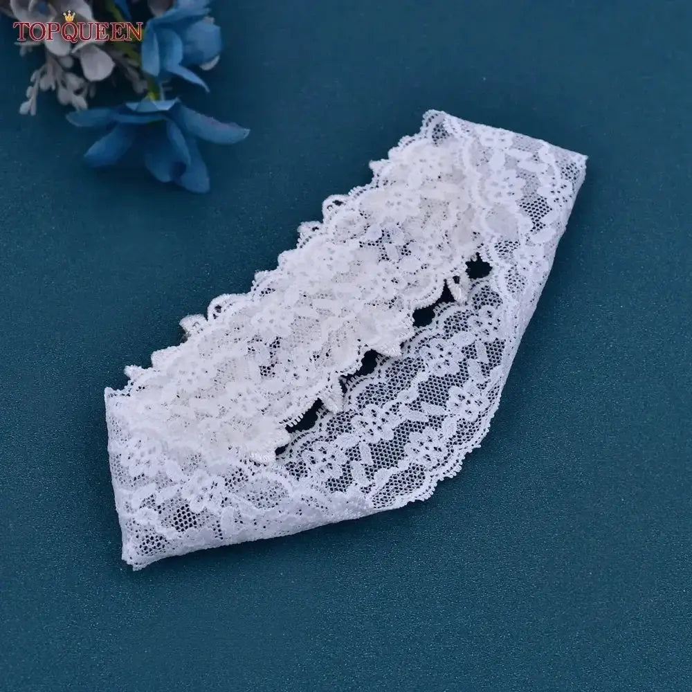 White lace Wedding Garter Belt with floral pattern and scalloped edges, delicate and elegant design
