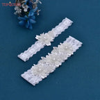 Wedding Garter Belt in white lace featuring flower patterns embellished with pearl and crystal beaded details