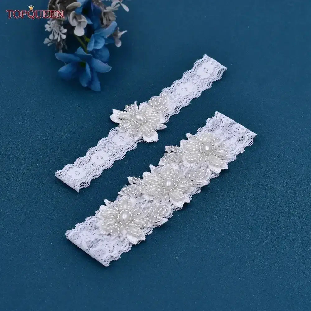 Wedding Garter Belt in white lace featuring flower patterns embellished with pearl and crystal beaded details
