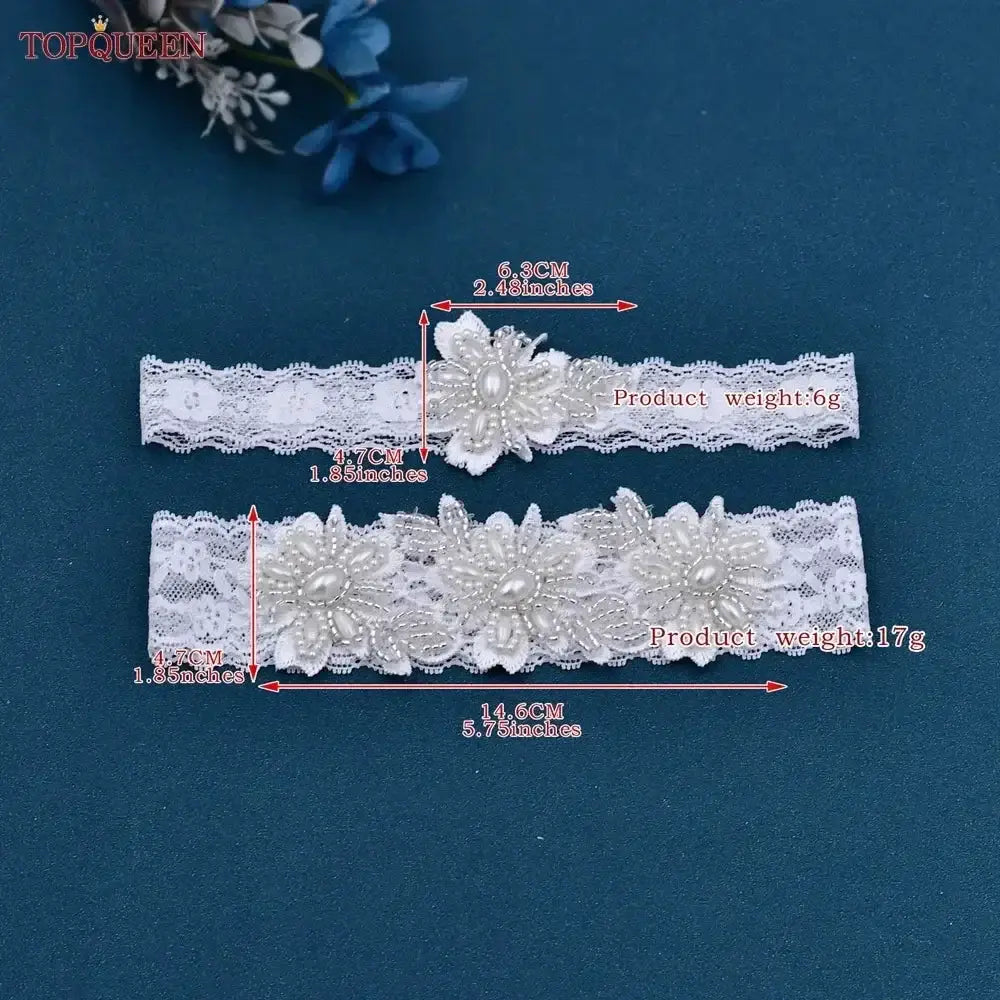 Wedding Garter Belt set in white lace with pearl and crystal flower embellishments, measuring 5.3cm and 14.6cm wide