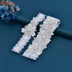 Wedding Garter Belt set featuring white lace with delicate pearl crystal flower embellishments for bridal wear