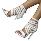 White Lace-Up Heels with crisscross straps, open toe, high stiletto heel, and back zipper closure on smooth leather