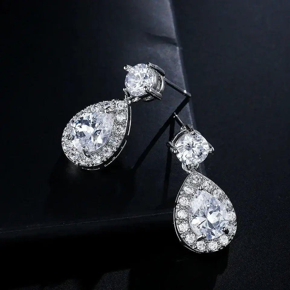 ZAKOL Classic Water Drop Earrings featuring white cubic zirconia stones in silver-tone metal with a dangle teardrop design