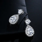 ZAKOL Classic Water Drop Earrings featuring white cubic zirconia stones in silver-tone metal with a dangle teardrop design