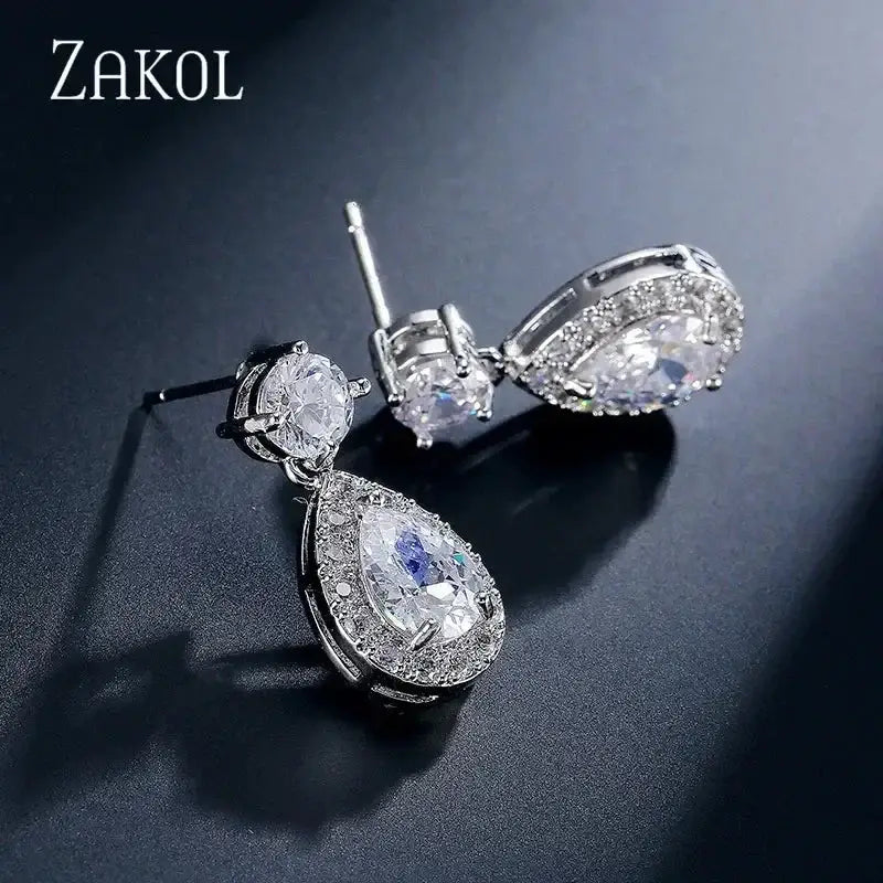 ZAKOL Classic Water Drop Earrings featuring silver-tone metal with sparkling white cubic zirconia stones in dangle design