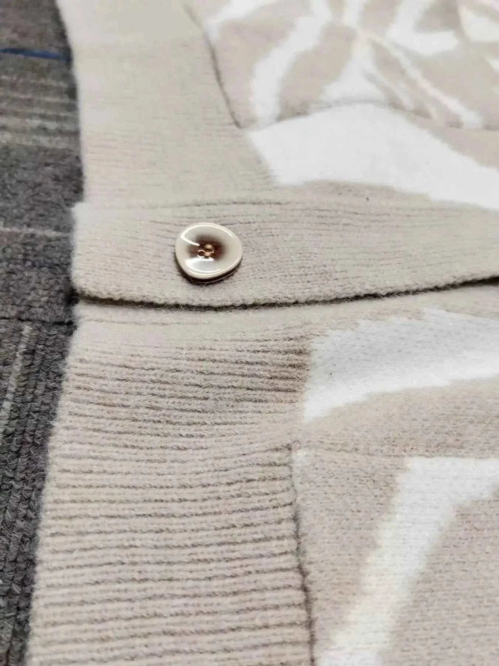 Zebra Print Button Up cardigan in beige and white polyester with a button and ribbed knit detailing