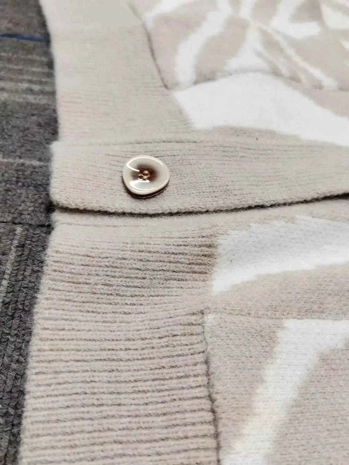 Zebra Print Button Up cardigan in beige and white polyester with a button and ribbed knit detailing