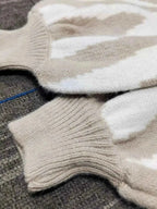 Zebra Print Button Up cardigan with beige and white stripes, ribbed cuffs, and soft knit fabric, slightly stretchy