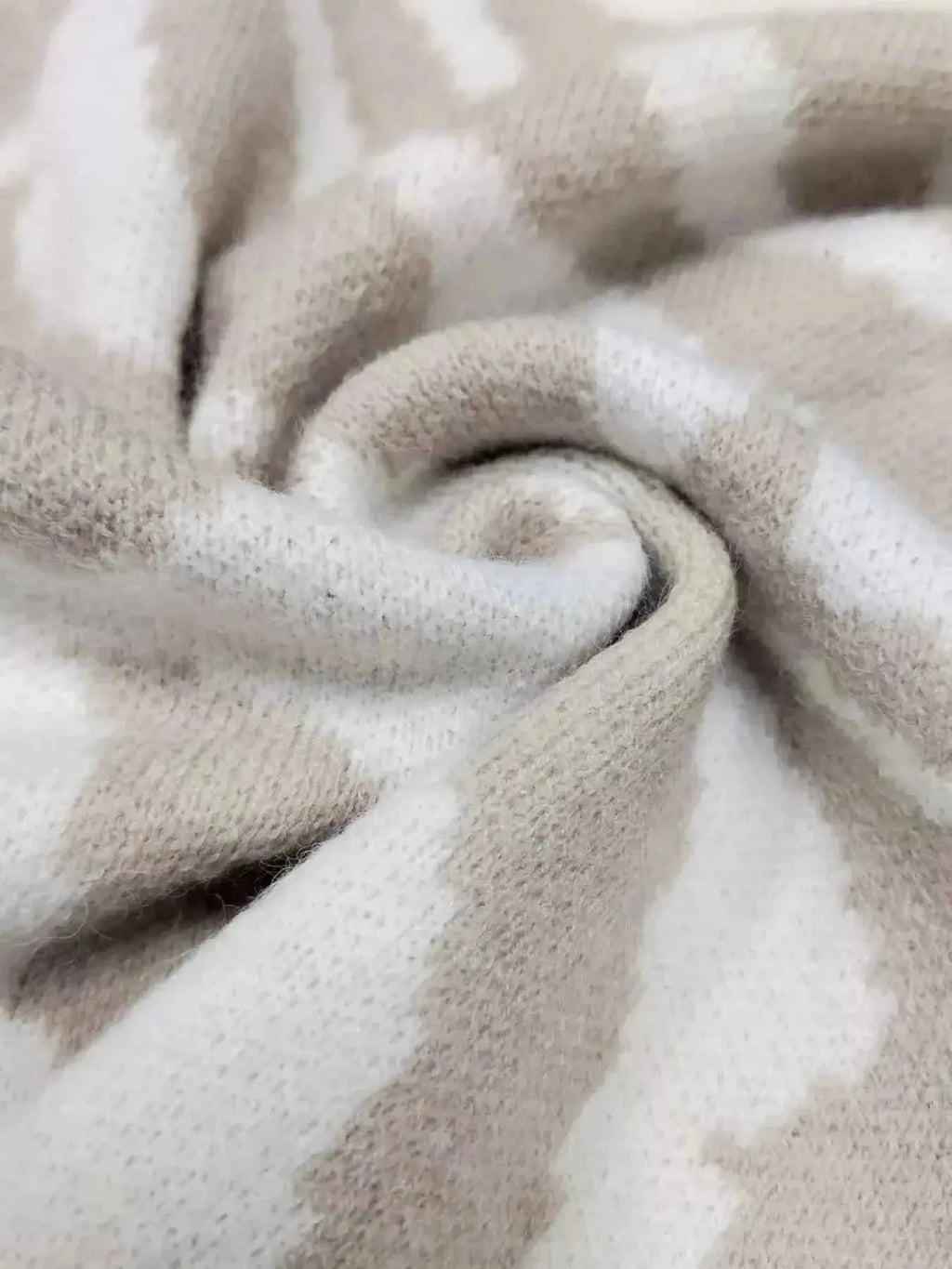 Zebra Print Button Up fabric close-up in beige and white, showing soft polyester material with slight stretch