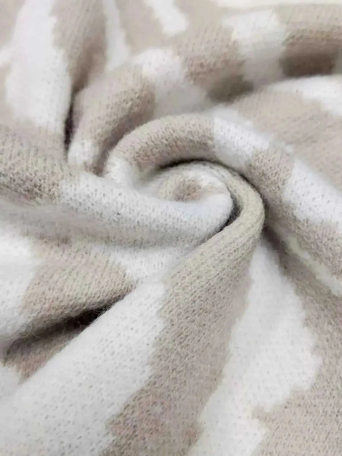 Zebra Print Button Up fabric close-up in beige and white, showing soft polyester material with slight stretch