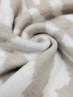 Zebra Print Button Up fabric in soft beige and off-white with a subtle animal stripe pattern, slightly stretchy polyester