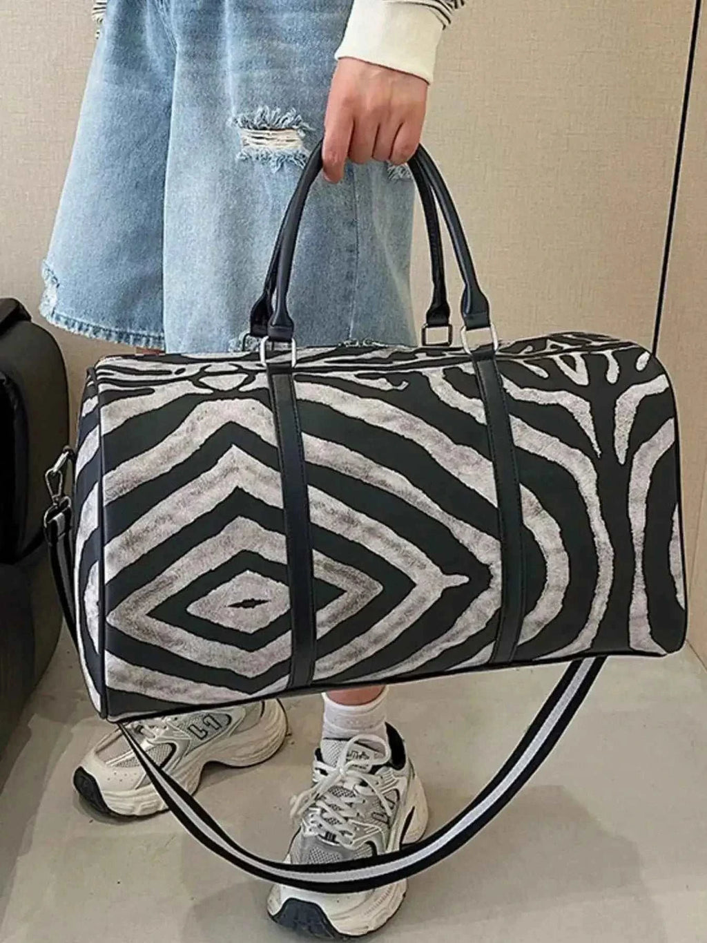 Zebra Print Duffle Bag in black and white PU leather with geometric zebra pattern and black handles, large size