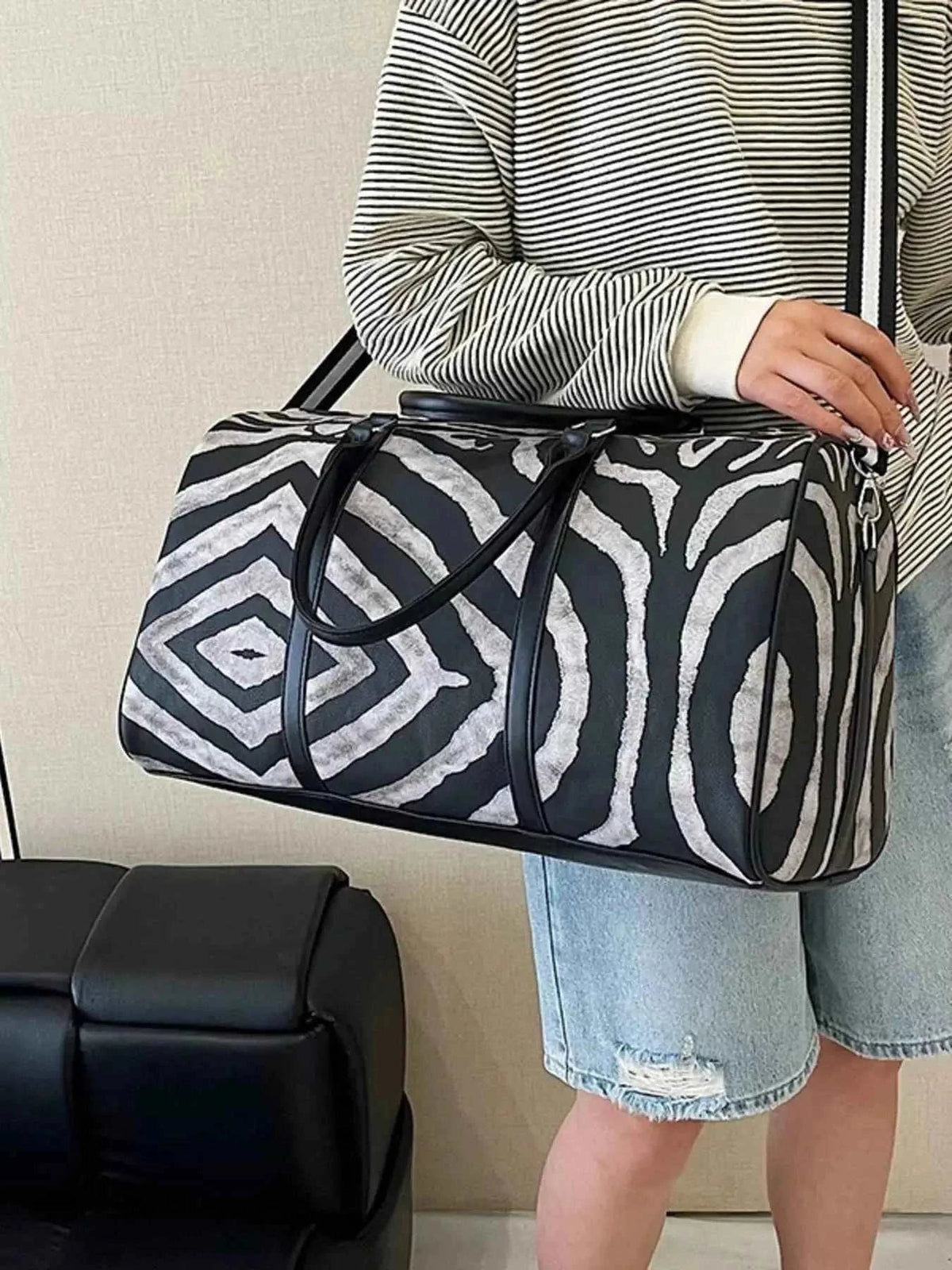 Zebra Print Duffle Bag in large size with black and white zebra pattern, made of PU leather with black handles