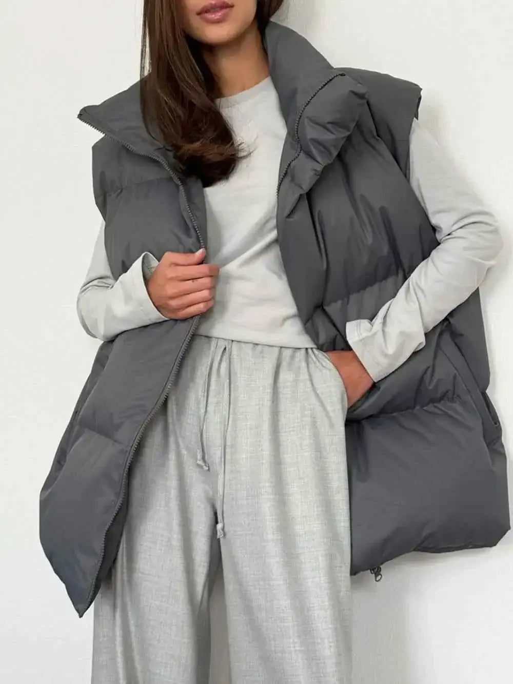 Zip Up Turtleneck Vest in dark grey, padded polyester with a high turtleneck collar and front zipper closure